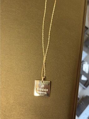 100 authentic Gucci Gold Square Logo Pendant Necklace
